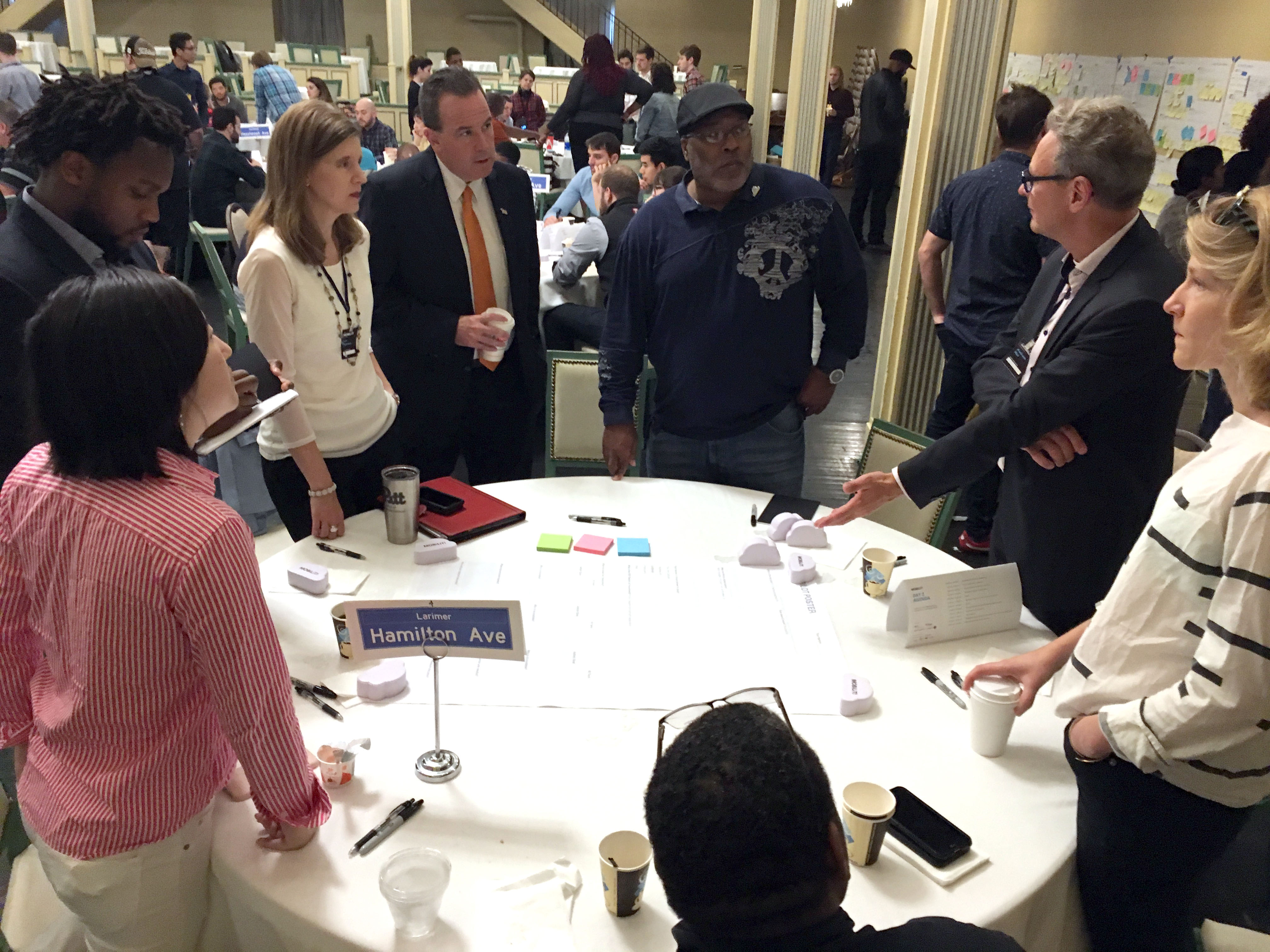 A group explaining their pilot to other attendees